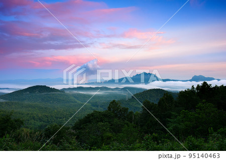 Beautiful sea of fog in the mountains, high voltage pole and steam from the coal power plant in the morning sunrise . Mae moh, Lampang, Thailand. Energy and environment concept .. Beautiful sea of fog in the mountains, high voltage pole and steam from the coal power plant in the morning sunrise . Mae moh, Lampang, Thailand. Energy and environment concept .. 95140463