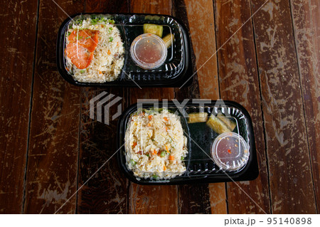 Top view of traditional khmer food packed in single use plastic for delivery Top view of traditional khmer food packed in single use plastic for delivery 95140898