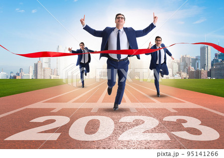 Businessman running to new 2023 year Businessman running to new 2023 year 95141266