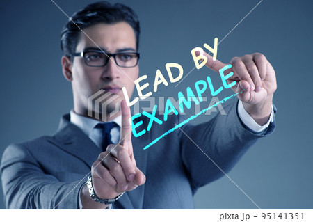 Businessman in lead by example concept 95141351