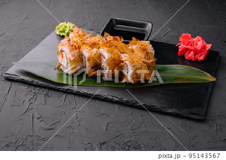 Sushi bonito roll on a dark background Sushi bonito roll on a dark background 95143567