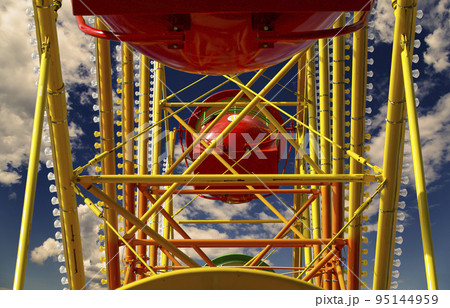 Attraction (carousel) ferris wheel against the background of a romantic evening sky 95144959
