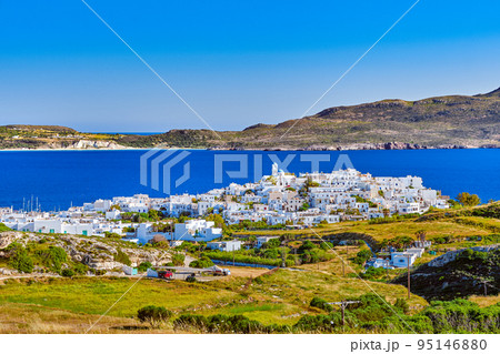 Beautiful view of Adamantas, main town of Milos island, Greece, on sunny day. Hill top town, whitewashed houses, church bell tower, Beautiful view of Adamantas, main town of Milos island, Greece, on sunny day. Hill top town, whitewashed houses, church bell tower, 95146880