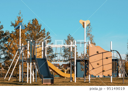 Colorful children playground during autumn season Colorful children playground during autumn season 95149019