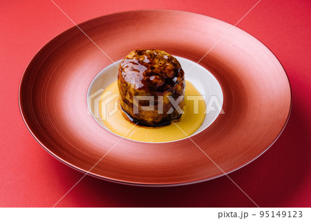 Beef medallion steak on red plate Beef medallion steak on red plate 95149123
