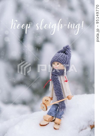 Keep sleigh-ing Inspiration joke quote phrase Angel gnome in scarf and knitted hat skiing on snowy fir branch Elf toy on skis in snowy landscape New year and Merry Christmas greeting card winter 95149770
