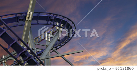 Attraction roller-coaster (switchback) against the background of a romantic evening sky 95151860