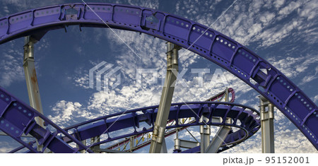 Attraction roller-coaster (switchback) on the background of the cloudy sky Attraction roller-coaster (switchback) on the background of the cloudy sky 95152001