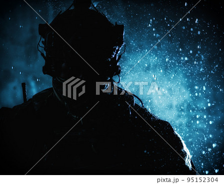 Soldier in tactical ammunition, wearing camo uniform, battle helmet, radio headset, hiding face behind scarf, silhouette in the darkness, night rain, closeup shot 95152304