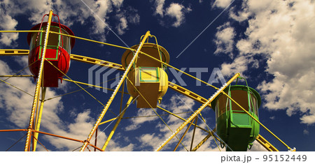 Attraction (carousel) ferris wheel against the background of a romantic evening sky 95152449
