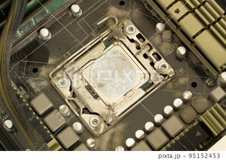 Very dirty computer processor. Dusty CPU microchip on a computer motherboard with traces of cooler grease. The electronic board in the computer workshop is prepared for cleaning. Service electronics 95152453