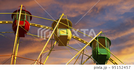 Attraction (carousel) ferris wheel against the background of a romantic evening sky Attraction (carousel) ferris wheel against the background of a romantic evening sky 95152457
