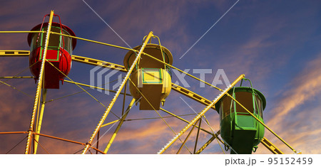Attraction (carousel) ferris wheel against the background of a romantic evening sky Attraction (carousel) ferris wheel against the background of a romantic evening sky 95152459