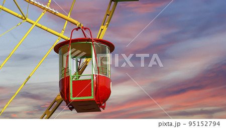Attraction (carousel) ferris wheel against the background of a romantic evening sky 95152794