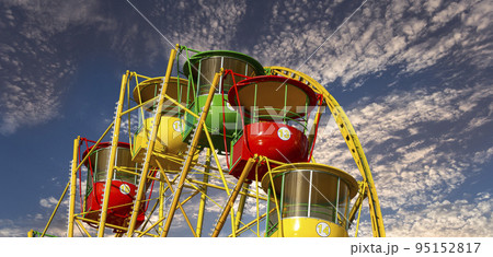 Attraction (carousel) ferris wheel against the background of a romantic evening sky Attraction (carousel) ferris wheel against the background of a romantic evening sky 95152817