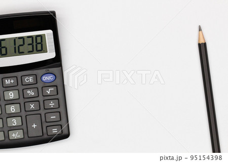 Top view office table desk. Financial report. Flat lay. Workspace with Business office supplies, empty sheet of paper, pencil, calculator on the table. Copy space for text. Top view. Close-up Top view office table desk. Financial report. Flat lay. Workspace with Business office supplies, empty sheet of paper, pencil, calculator on the table. Copy space for text. Top view. Close-up 95154398