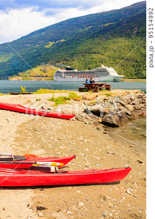 Kayaks and cruise ship in Flam, Norway Kayaks and cruise ship in Flam, Norway 95154992