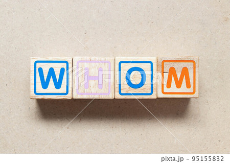 Color letter block in word whom on wood background 95155832