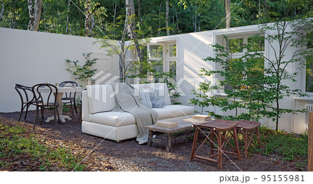 A Surreal Fantasy photo-manipulation with a mossy sofa outside by the lake in the forest and a two flamingos sitting on it. Idyllic scenery as if it came out of a fairy tale. 95155981