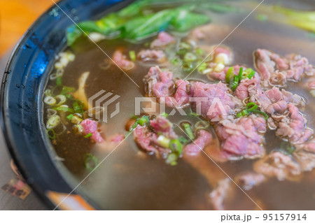 Noodle with slice of raw beef, famous cuisine in Kinmen of Taiwan 95157914