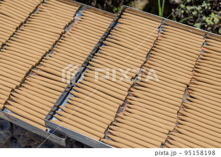 Dry Incense under the sunlight at outdoor 95158198