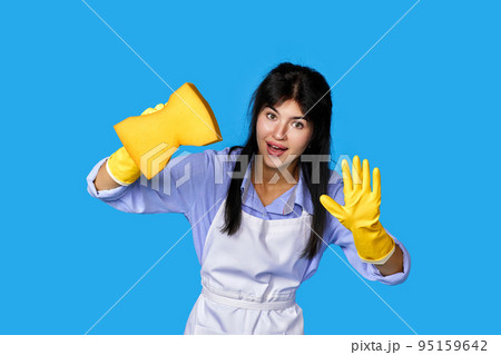 woman in gloves and cleaner apron with detergent sprayer woman in gloves and cleaner apron with detergent sprayer 95159642