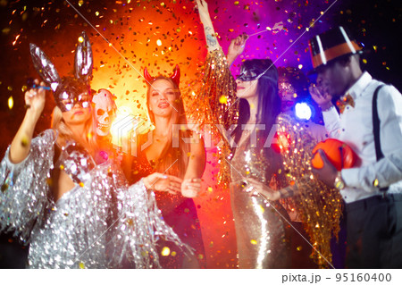 People dance at Halloween party 95160400