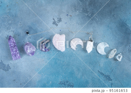 Healing crystals on brown background 95161653