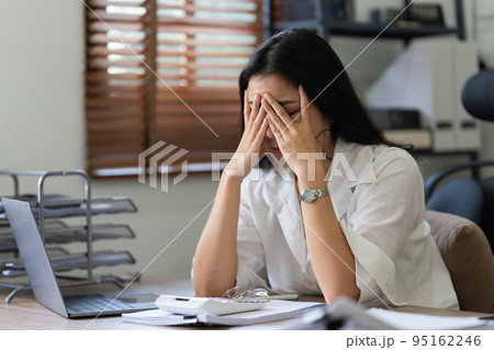 Asian business woman worry about marketing plan of this years. Account, Real Estate Agent, Finance concpet Asian business woman worry about marketing plan of this years. Account, Real Estate Agent, Finance concpet 95162246