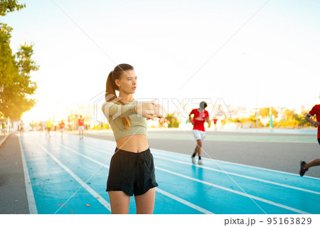 Woman Stretching And Warming-Up Before Running. 95163829