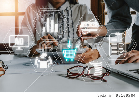 Add to cart internet web store buy online E-Commerce concept, Two person hand using digital tablet with shopping chart on VR screen, Online shopping. 95169584