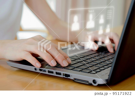 A Businesswoman use laptop for analyze and management team on virtual screen. A Businesswoman use laptop for analyze and management team on virtual screen. 95171922
