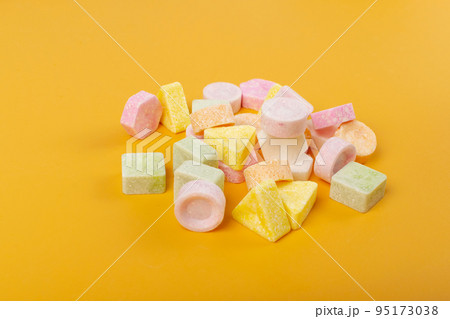Scattered Tablet Candies on Black, Compressed Tablets 95173038