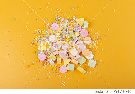 Tablet Candies on Yellow Background, Compressed Tablets 95173040