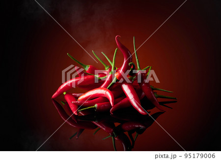 Red chili pepper with smoke. 95179006