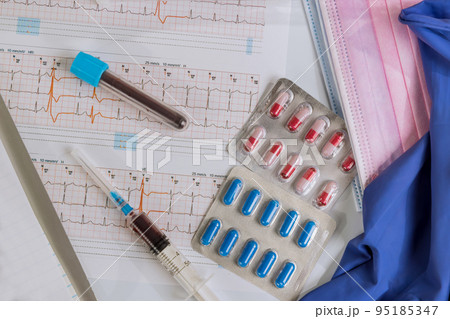 Doctor examines patient cardiogram picks him treatment of heart disease 95185347