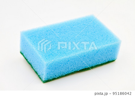 Blue foam cleaning sponge for washing dishes, cleaning the bathroom and other household needs on a white background. Closeup Blue foam cleaning sponge for washing dishes, cleaning the bathroom and other household needs on a white background. Closeup 95186042