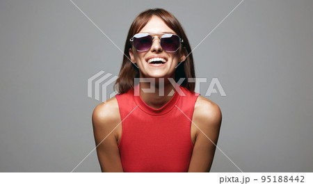 Happy beautiful Girl in Sunglasses. Smiling young woman Happy beautiful Girl in Sunglasses. Smiling young woman 95188442
