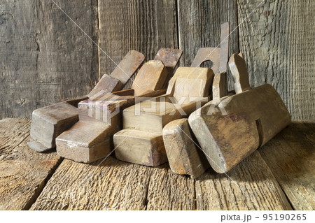 Antique wooden plane on the table 95190265