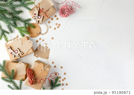Christmas giftbox and presents wrapping in craft paper and decor 95190871