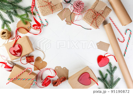 Christmas giftbox and presents wrapping in craft paper and decor Christmas giftbox and presents wrapping in craft paper and decor 95190872