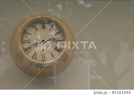 Vintage clock hanging at the wall. 95191949