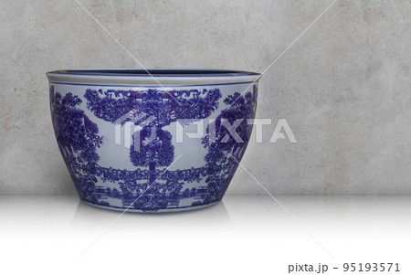 antique white and blue ceramic pot on floor, cement wall background, object, vintage, retro, ancient, template, banner, copy space 95193571