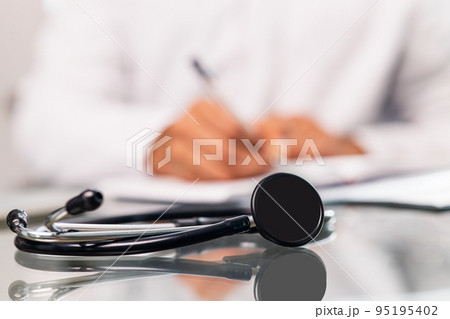 Unrecognizable male doctor In uniform and stethoscope close up 95195402