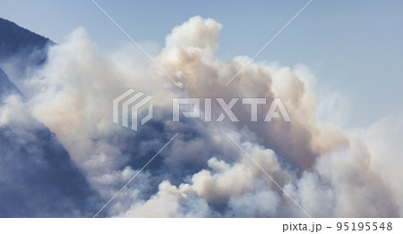 BC Forest Fire and Smoke over the mountain near Hope during a hot sunny summer day. BC Forest Fire and Smoke over the mountain near Hope during a hot sunny summer day. 95195548