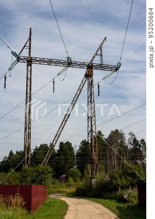 High-voltage power line passing over summer cottages High-voltage power line passing over summer cottages 95200664