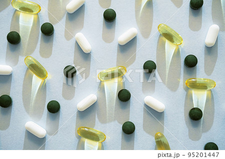 Some pills, vitamin capsules or dietary supplement supports for health. 95201447
