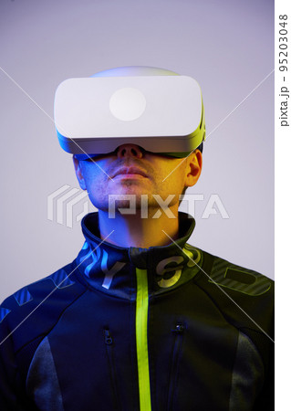 Man is using virtual reality headset. Concept of virtual, augmented and extended reality and metaverse. 95203048