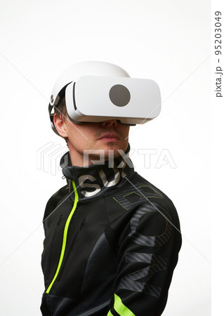 Man is using virtual reality headset. Concept of virtual, augmented and extended reality and metaverse. Man is using virtual reality headset. Concept of virtual, augmented and extended reality and metaverse. 95203049