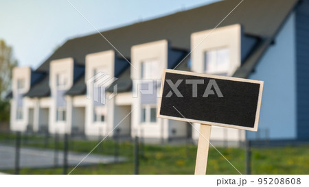 Blank Black billboard against apartment family house Empty mockup template Blackboard label at Townhome. Copy space banner for your text. Multi-family House Concept of rent, price house, buying house Blank Black billboard against apartment family house Empty mockup template Blackboard label at Townhome. Copy space banner for your text. Multi-family House Concept of rent, price house, buying house 95208608